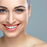 Woman smile. Teeth whitening. Dental care.